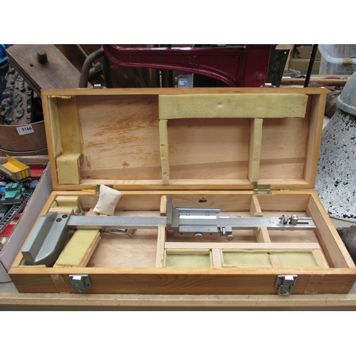 9169 - A wooden cased Fowler measuring tool