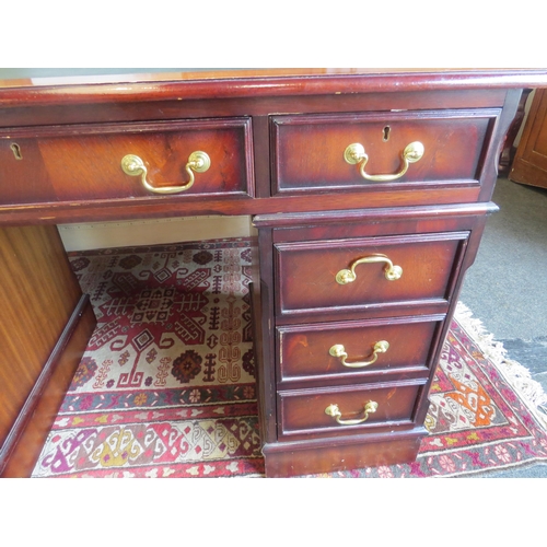 1007 - A reproduction Georgian style twin pedestal desk with leather inset top, 78cm high x 120cm wide x 60... 