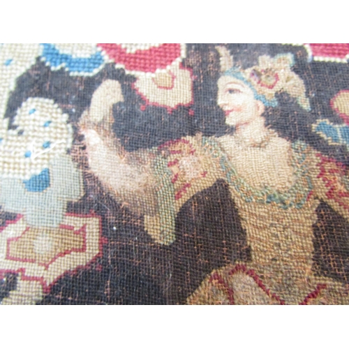 1030 - An early embroidery of figures and dragon, 57cm x 31cm