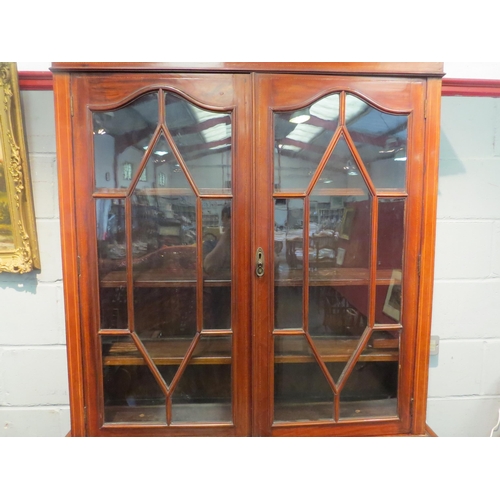 1052 - A mahogany secretaire bookcase with astragal glazed upper section, single drawer over twin door cupb... 