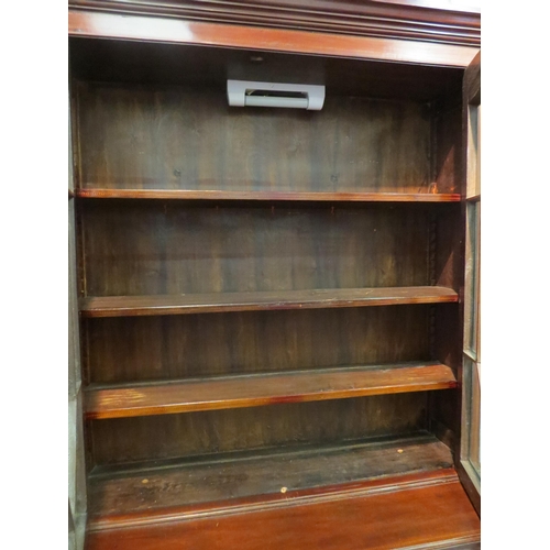 1052 - A mahogany secretaire bookcase with astragal glazed upper section, single drawer over twin door cupb... 