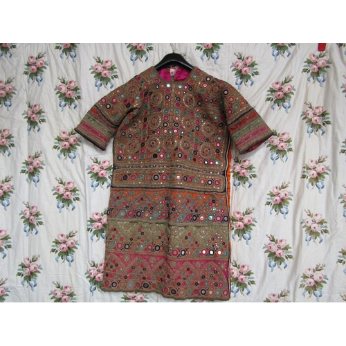 1078 - An early 20th Century Indian lady's tunic, the tunic is heavily embroidered with mirror roundels and... 