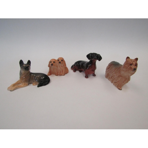 1473 - Four Beswick small dogs: Alsatian model no. 3378, Cocker Spaniels model no. 3383, Yorkshire Terrier ... 