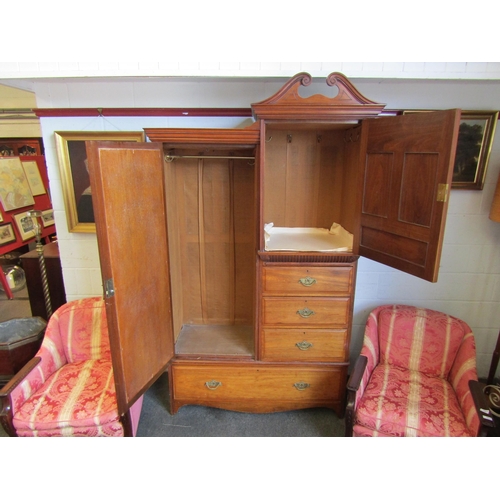 1013 - A late Victorian walnut compactum wardrobe, mirrored door and cabinet over four drawers, on bracket ... 