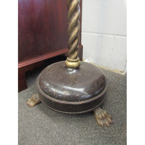 1021 - An early 20th Century brass standard lamp with rope twist support