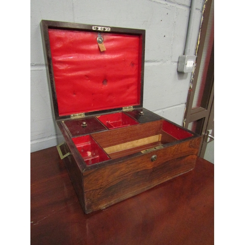 1043 - A Victorian rosewood writing box, campaign style brass inset handles, fitted interior, the lid with ... 