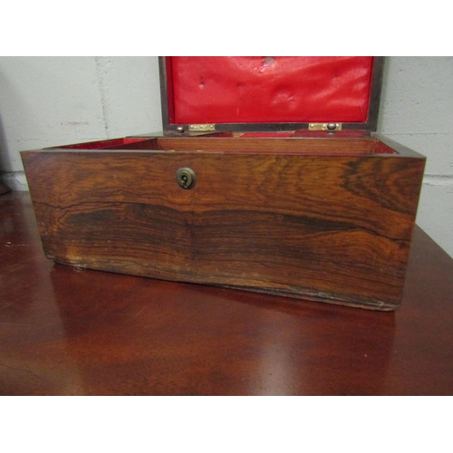 1043 - A Victorian rosewood writing box, campaign style brass inset handles, fitted interior, the lid with ... 