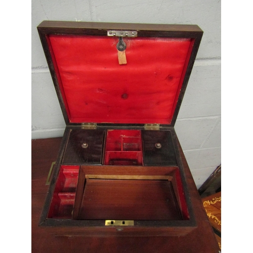 1043 - A Victorian rosewood writing box, campaign style brass inset handles, fitted interior, the lid with ... 