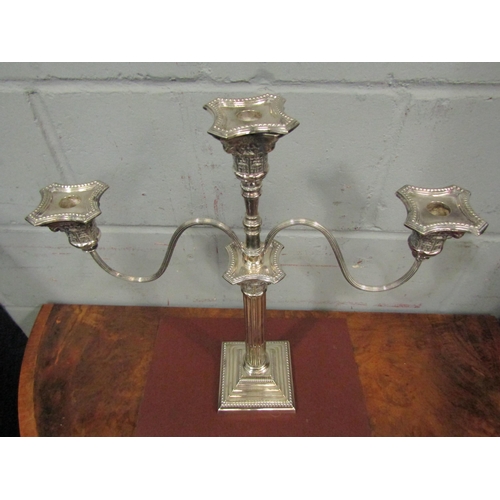 1055 - A mid-Century Corinthian column three branch quality silver plated candlestick, 47cm high