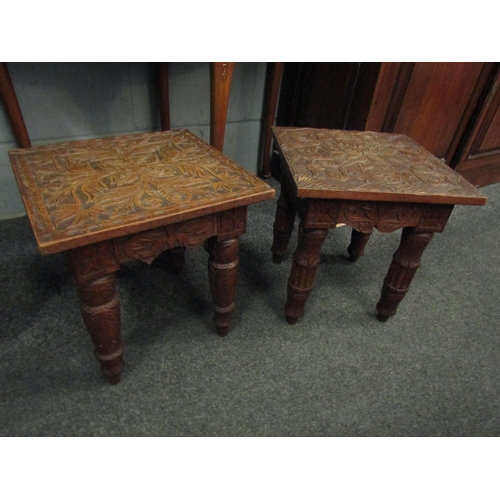 1057 - A pair of small carved oak coffee tables, both with foliate design, dated 1944 to underside, one mar... 