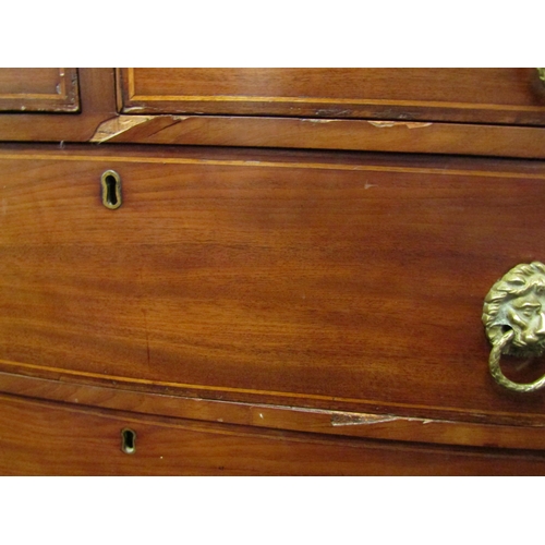 1069 - A Victorian mahogany bow fronted chest of two short over three long drawers, lion mask handles, outs... 