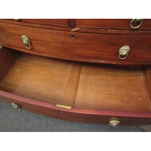 1069 - A Victorian mahogany bow fronted chest of two short over three long drawers, lion mask handles, outs... 