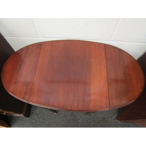 1073 - A mahogany Pembroke table with single end drawer and under-tier, tapering legs to castors  (E)  £15-... 