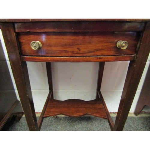 1073 - A mahogany Pembroke table with single end drawer and under-tier, tapering legs to castors  (E)  £15-... 