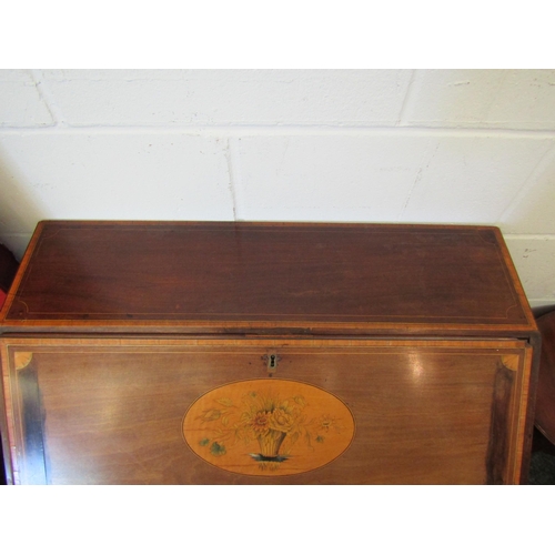 1077 - A 19th Century mahogany bureau, the front with oval marquetry panel, over four drawers, satinwood cr... 