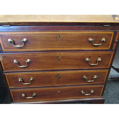 1077 - A 19th Century mahogany bureau, the front with oval marquetry panel, over four drawers, satinwood cr... 