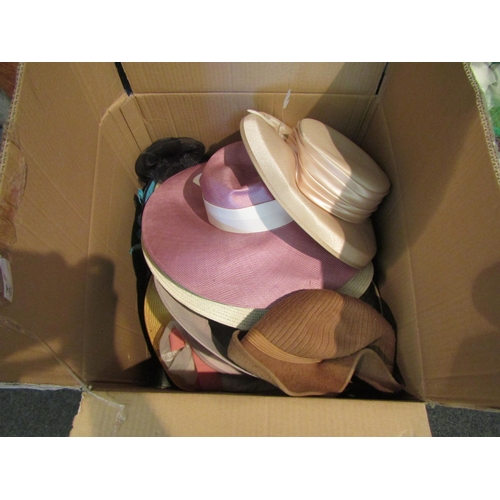 1082 - A good quantity of ladies' fashion hats together with a pale pink faux leather vanity case