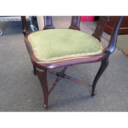 1098 - An Edwardian mahogany corner chair, scrolled foliate carved back rest over pierced splats, upholster... 