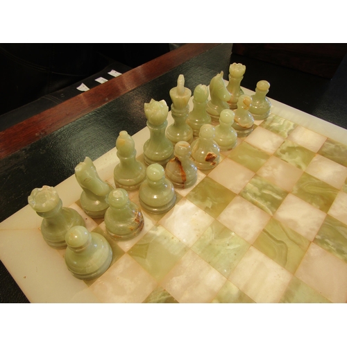 1101 - A marble chess board with onyx pieces, cased