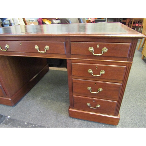 1103 - A Victorian nine drawer mahogany desk with original leather insert and brass handles, 76cm high x 15... 