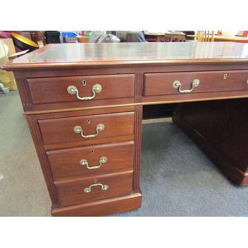 1103 - A Victorian nine drawer mahogany desk with original leather insert and brass handles, 76cm high x 15... 