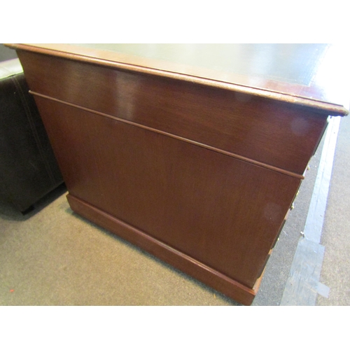 1103 - A Victorian nine drawer mahogany desk with original leather insert and brass handles, 76cm high x 15... 