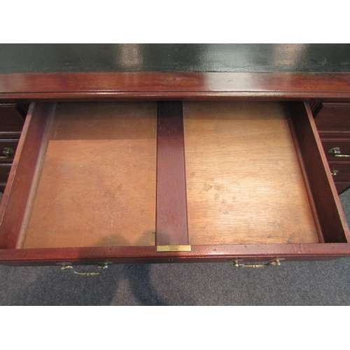 1103 - A Victorian nine drawer mahogany desk with original leather insert and brass handles, 76cm high x 15... 