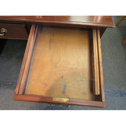 1103 - A Victorian nine drawer mahogany desk with original leather insert and brass handles, 76cm high x 15... 