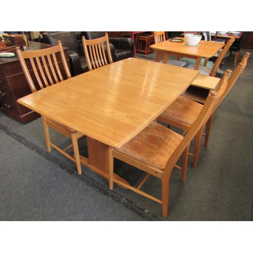 1132 - An Ercol light elm Windsor extending dining table, 72cm high x 150cm long x 92cm wide not extended, ... 