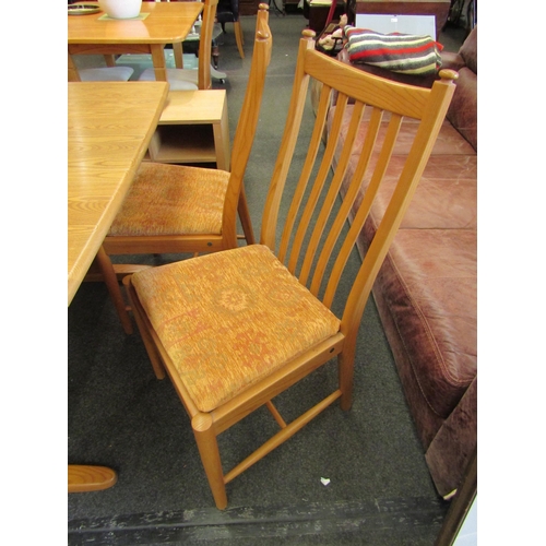 1132 - An Ercol light elm Windsor extending dining table, 72cm high x 150cm long x 92cm wide not extended, ... 