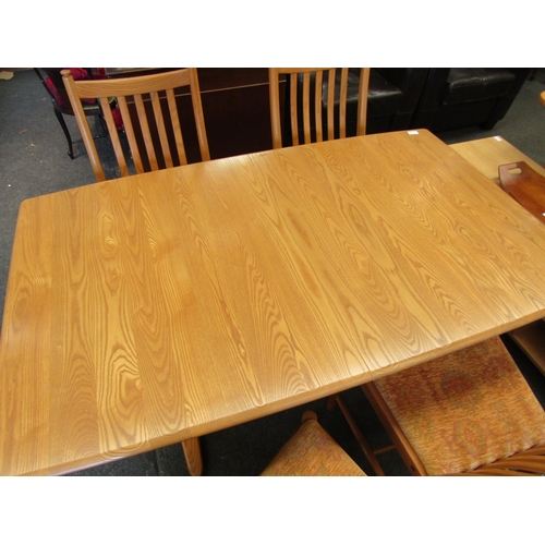 1132 - An Ercol light elm Windsor extending dining table, 72cm high x 150cm long x 92cm wide not extended, ... 