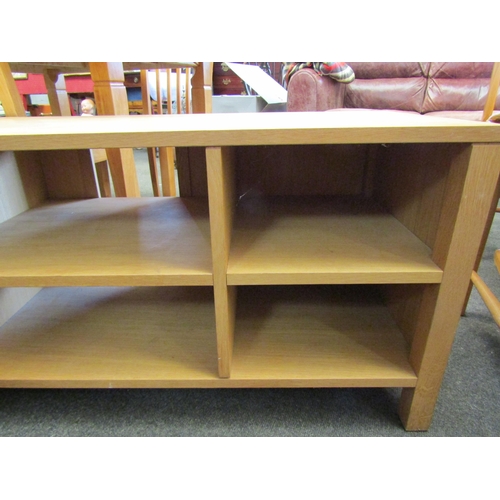 1134 - A modern oak shelved TV unit, 50cm high x 117cm wide x 43cm deep