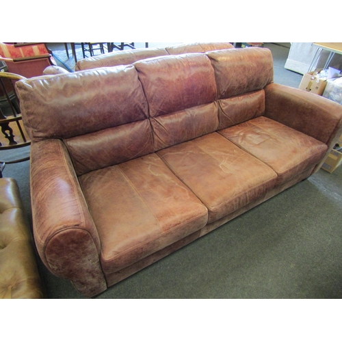 1145 - A modern leather three seater sofa