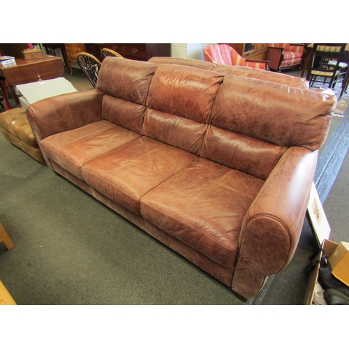 1145 - A modern leather three seater sofa