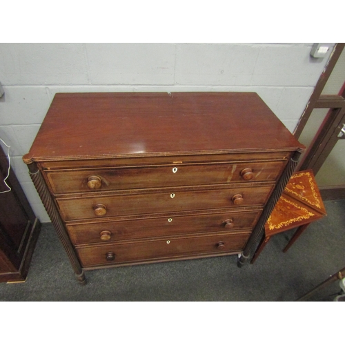 1046 - A 19th Century mahogany chest of four long drawers, satinwood stringing, turned bun handles, bone es... 