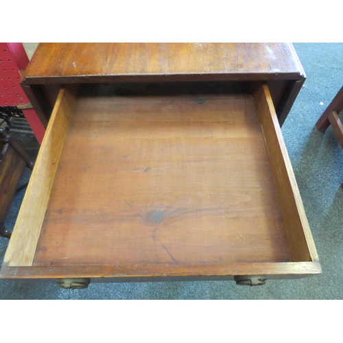 1148 - A mahogany Pembroke table, single drawer and faux drawer on tapering legs to castors