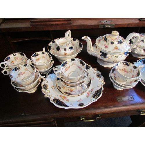 1002 - A Victorian tea set, white ground printed with flowers, cobalt blue and gilt decoration