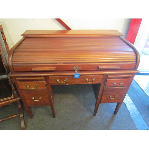 1008 - A 20th Century five drawer tambour front desk, 94cm high x 121cm wide x 71cm deep