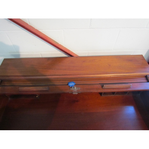 1008 - A 20th Century five drawer tambour front desk, 94cm high x 121cm wide x 71cm deep