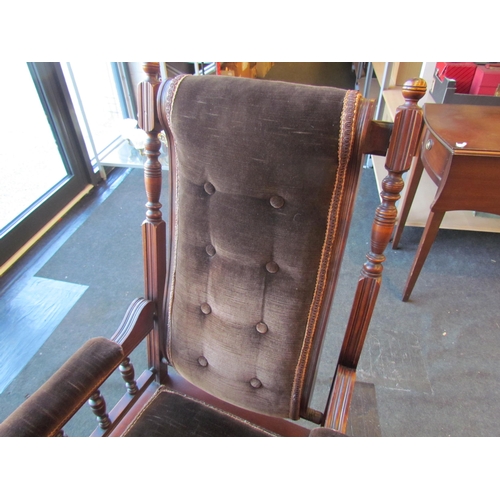 1009 - An American style button back rocking chair with turned spindle supports