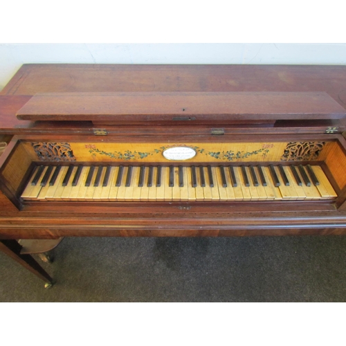 1016 - A late 19th Century mahogany string inlaid harpsichord on castors, 