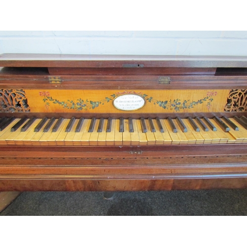 1016 - A late 19th Century mahogany string inlaid harpsichord on castors, 