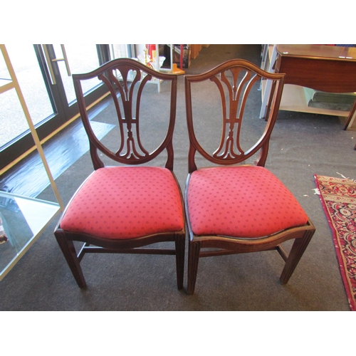 1020 - A pair of 19th Century mahogany shield-back dining chairs, drop-in seats        (E) £10-20