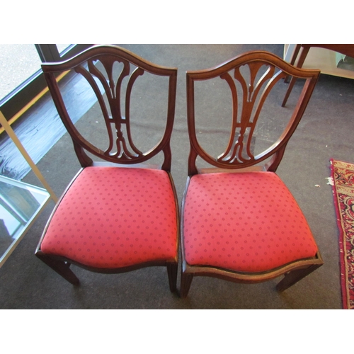 1020 - A pair of 19th Century mahogany shield-back dining chairs, drop-in seats        (E) £10-20