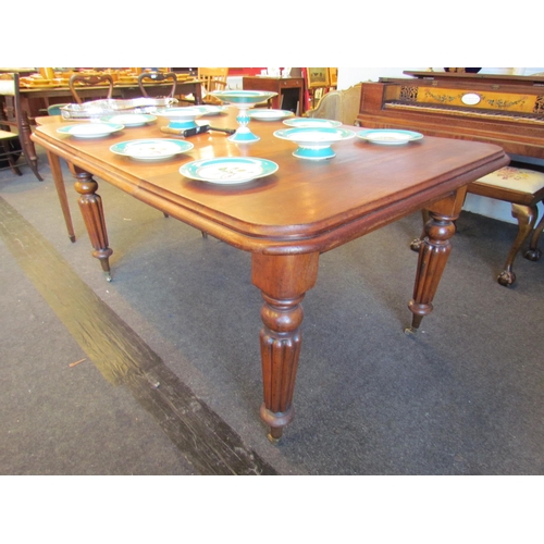 1022 - A 19th Century mahogany extending dining table, melon fluted legs on castors, 72cm high x 100cm wide... 