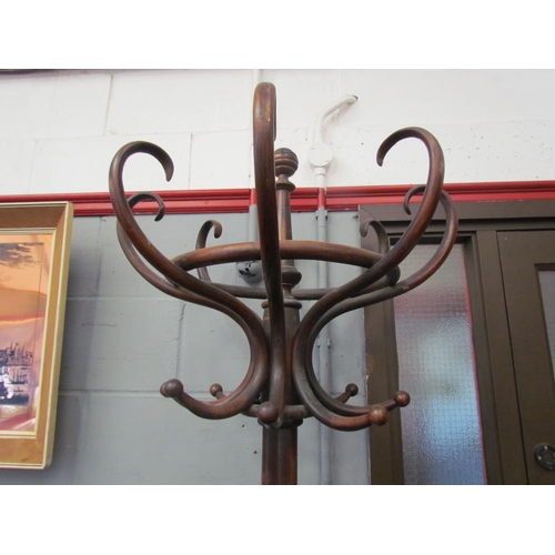 1040 - A bentwood hat and coat stand, 202cm tall