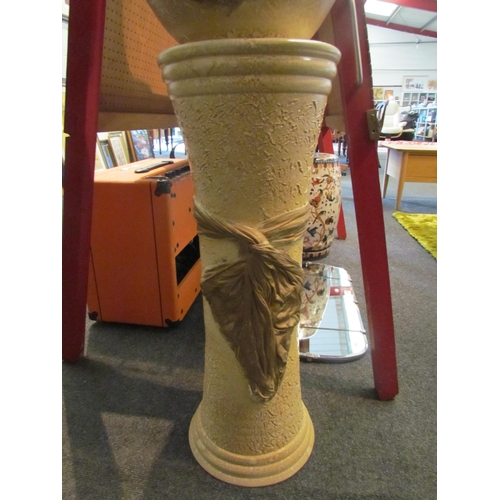 1041 - A pottery jardiniere on stand with gilt design, 117cm high