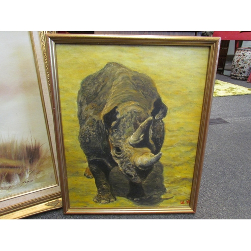 1080 - An oil on canvas depicting a lion, 51cm x 60cm, and an oil on board of a rhino, 50cm x 40cm, both fr... 