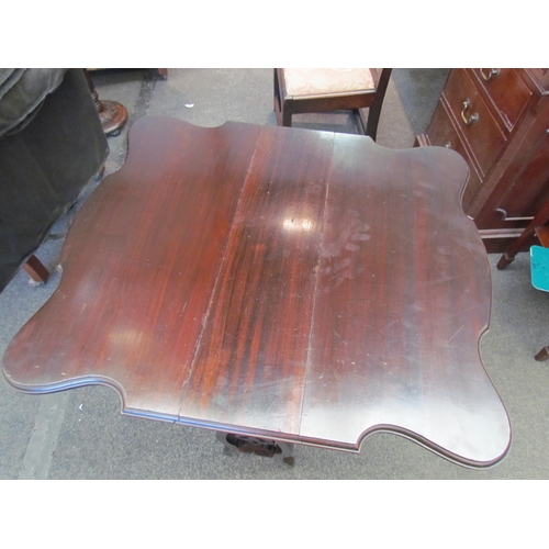 1105 - A small mahogany occasional drop-leaf table with fretwork decoration