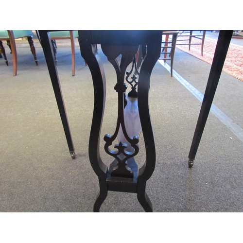 1105 - A small mahogany occasional drop-leaf table with fretwork decoration